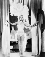 Betty Grable - Betty Grable Posed with Hands Raised Up in Fur Headdress in White Sexy Strap Dress with Fur Bottoms